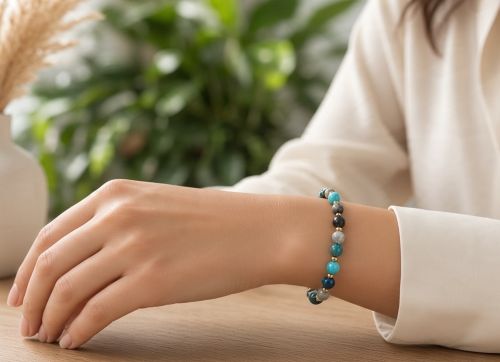 Dames armband stenenmix blauw 8 mm met goudkleurige kralen