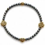Dames armband Bronziet 4 mm met goudkleurige tussenkralen