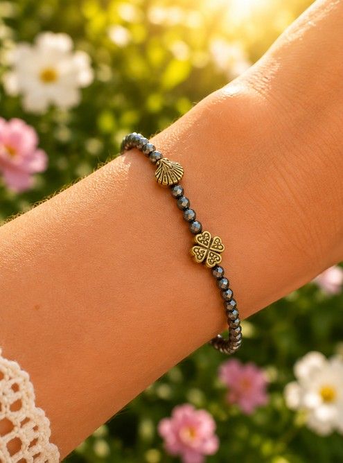 Dames armband Bronziet 4 mm met goudkleurige tussenkralen