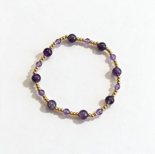 Dames armband Amethist 4 en 6 mm met RVS goudkleurige kralen