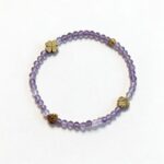 Dames armband Amethist 4 mm met goudkleurige tussenkralen