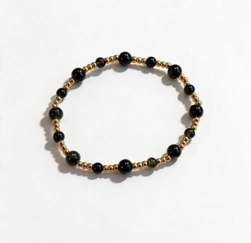 Dames armband Onyx 4 en 6 mm met RVS goudkleurige kralen