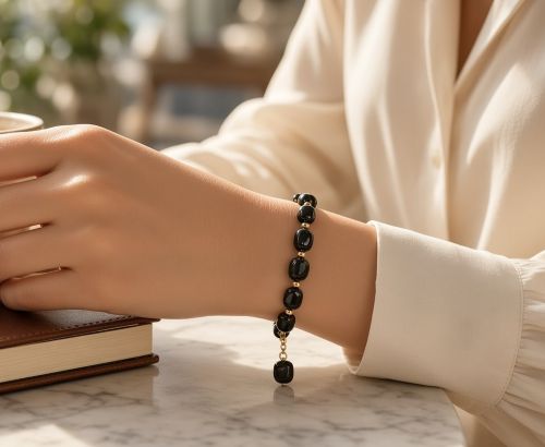 Dames armband Onyx met goudkleurige RVS tussenkralen