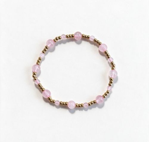 Dames armband Rozenkwarts 4 en 6 mm met RVS goudkleurige kralen