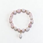 Dames armband Rozenkwarts met goudkleurige RVS tussenkralen